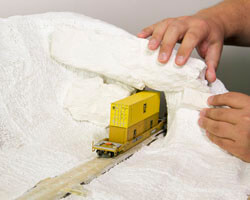 Diorama Part 11: Adding Rocks and Smoothing the Surface for Your Model Railroad